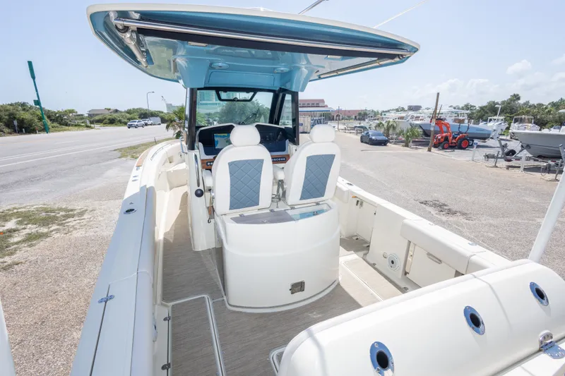 Slide: The Image of 2023 Chris-Craft Catalina 30 boat interior with dual captain seats and modern helm. - 25
