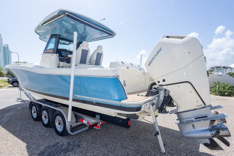 Slide: The Image of 2023 Chris-Craft Catalina 30 boat with Mercury engine on a trailer, side view. - 14
