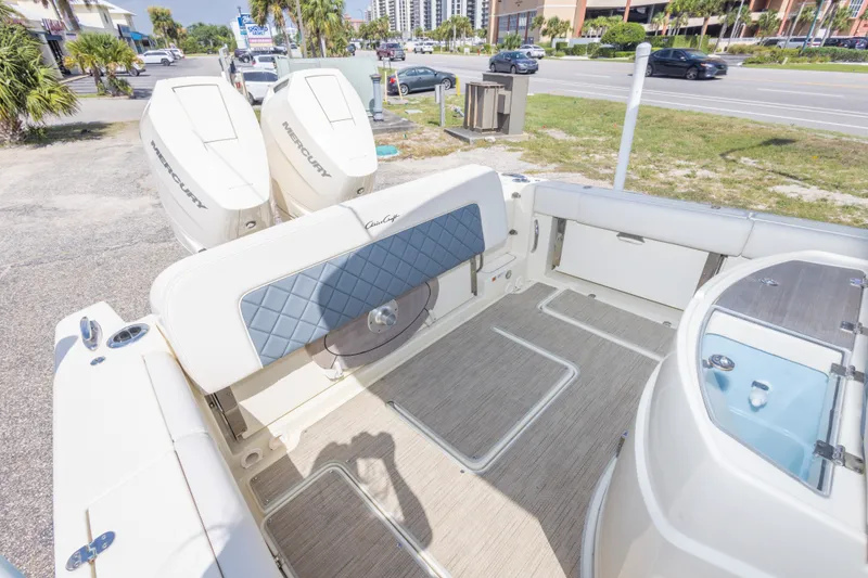 Slide: The Image of 2023 Chris-Craft Catalina 30 boat interior with Mercury engines, featuring spacious seating and modern design. - 49