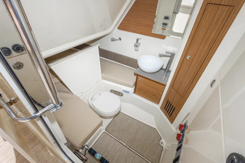 Slide: The Image of Modern bathroom interior of 2023 Chris-Craft Catalina 30 boat, featuring sleek design and amenities. - 34