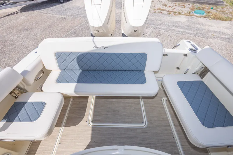 Slide: The Image of 2023 Chris-Craft Catalina 30 boat seating area with elegant blue and white upholstery. - 54