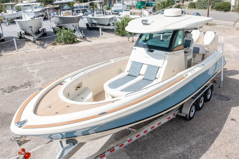 Slide: The Image of 2023 Chris-Craft Catalina 30 boat on trailer, showcasing sleek design and luxury features. - 4