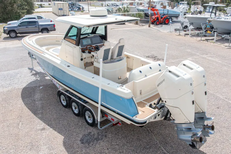 Slide: The Image of 2023 Chris-Craft Catalina 30 boat with dual Mercury engines on a trailer. - 62