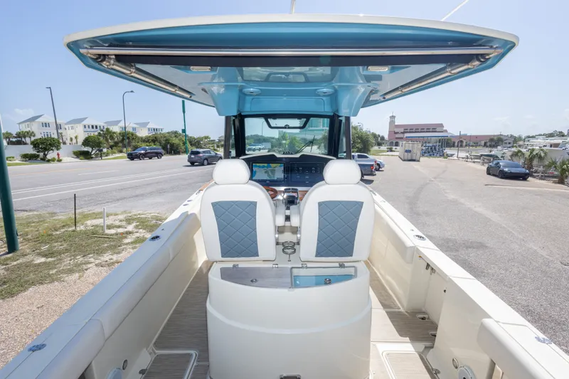 Slide: The Image of 2023 Chris-Craft Catalina 30 boat interior with dual seats and dashboard view. - 27