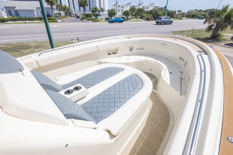 Slide: The Image of 2023 Chris-Craft Catalina 30 boat interior with luxurious seating and cup holders. - 37