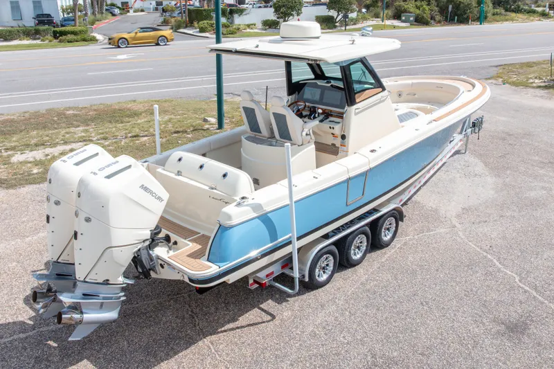 Slide: The Image of 2023 Chris-Craft Catalina 30 boat with dual Mercury engines on a trailer. - 60