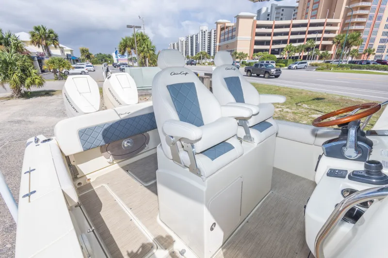 Slide: The Image of 2023 Chris-Craft Catalina 30 boat interior with luxury seating and modern controls. - 46