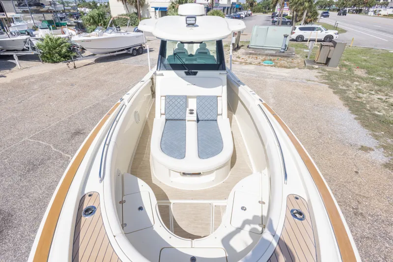 Slide: The Image of 2023 Chris-Craft Catalina 30 boat with spacious deck and seating, parked outdoors. - 39