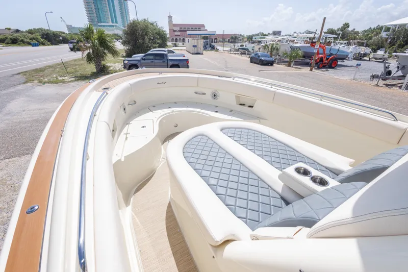 Slide: The Image of 2023 Chris-Craft Catalina 30 boat interior with luxurious seating and cup holders. - 36