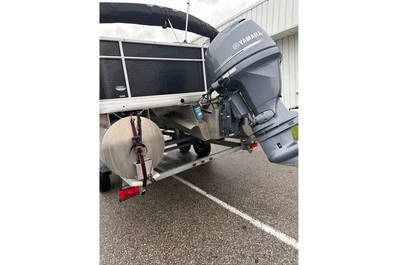 Slide: The Image of 2016 Godfrey Sweetwater 2286 pontoon boat with Yamaha outboard motor on trailer. - 6