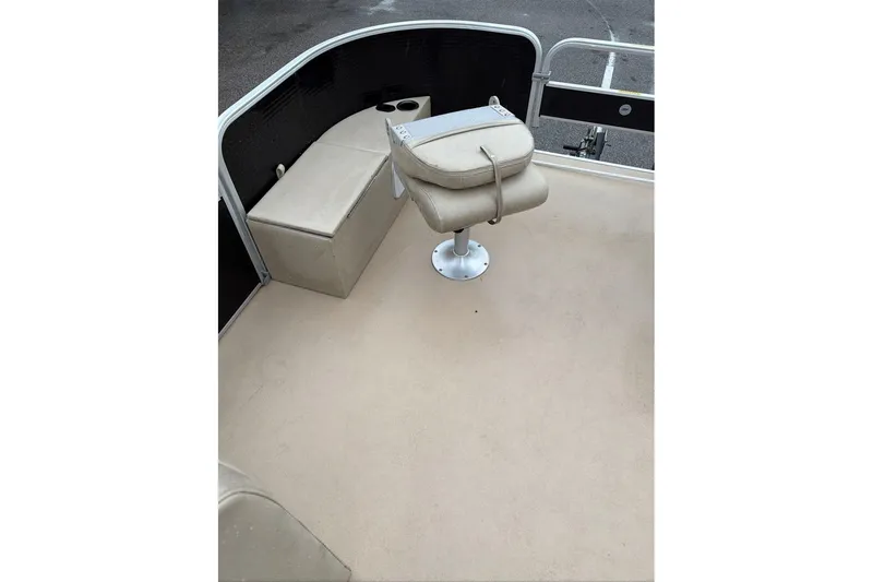 Slide: The Image of 2016 Godfrey Sweetwater 2286 boat interior with beige seating and cup holders. - 7