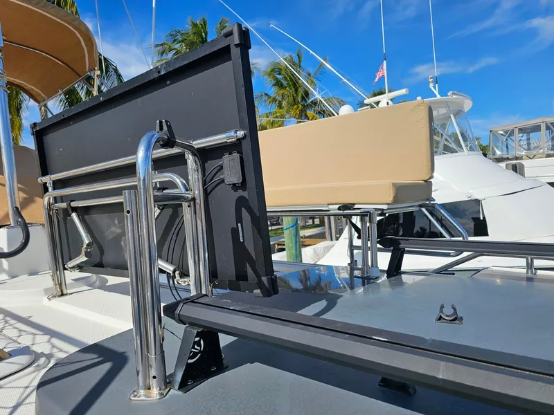 Slide: The Image of A 2014 Ranger Tugs 31-CB with a foldable seating area on the deck. - 17