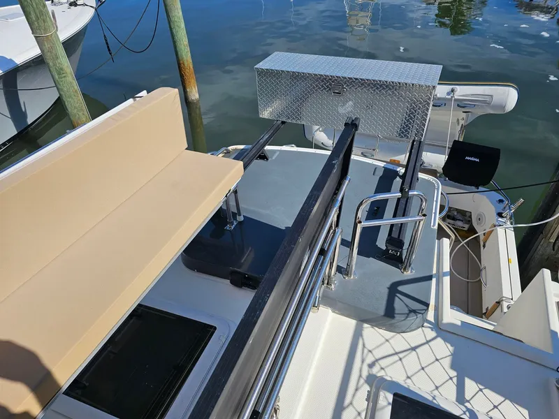 Slide: The Image of The image shows the stern of a 2014 Ranger Tugs 31-CB with seating and storage. - 14