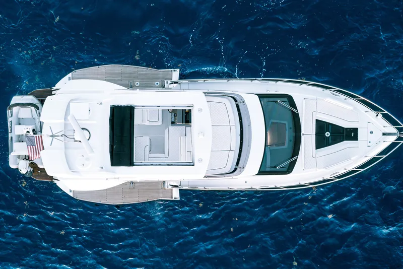 Slide: The Image of Top view of 2021 Galeon 500 Fly yacht on blue ocean water. - 10