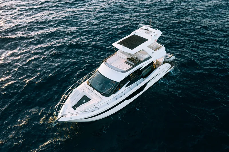 Slide: The Image of Aerial view of 2021 Galeon 500 Fly yacht cruising on open water. - 37