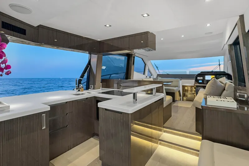 Slide: The Image of Luxurious interior of 2021 Galeon 500 Fly yacht with modern kitchen and ocean view. - 13
