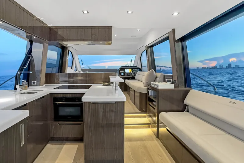 Slide: The Image of Luxurious interior of 2021 Galeon 500 Fly yacht with modern kitchen and ocean view. - 12