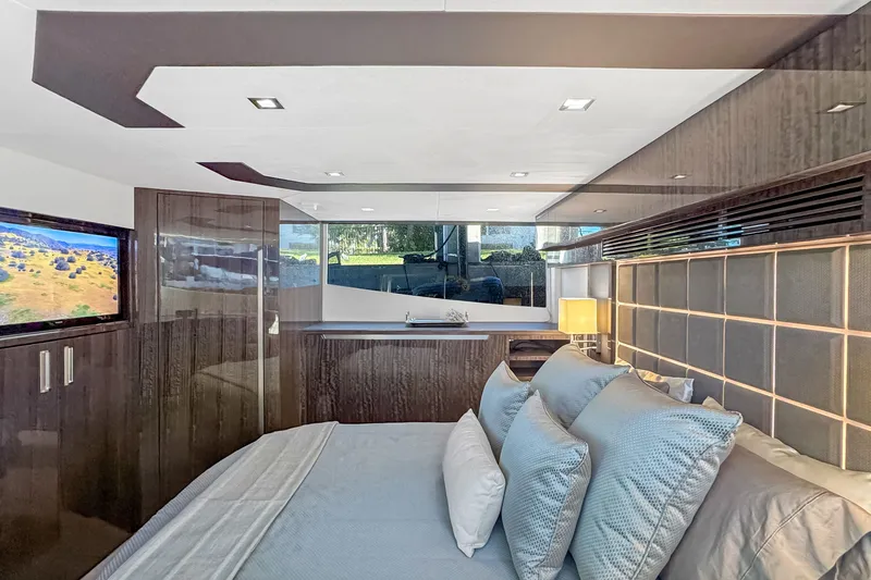 Slide: The Image of Luxurious interior of 2021 Galeon 500 Fly yacht with elegant bedding and modern decor. - 27