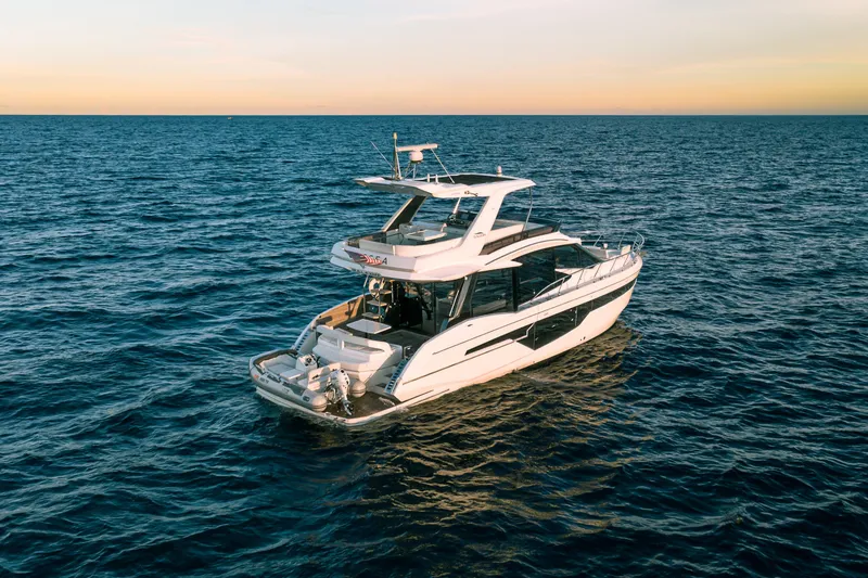 Slide: The Image of Luxury 2021 Galeon 500 Fly yacht cruising on open sea at sunset. - 2