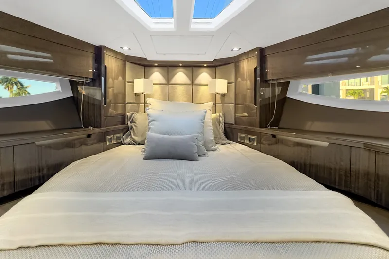 Slide: The Image of Luxurious bedroom interior of 2021 Galeon 500 Fly yacht with elegant bedding and modern lighting. - 30