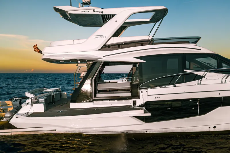 Slide: The Image of 2021 Galeon 500 Fly yacht cruising at sunset on open sea. - 3