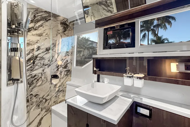 Slide: The Image of Luxurious bathroom interior of 2021 Galeon 500 Fly yacht with marble accents and modern fixtures. - 31