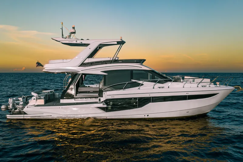 The Image of 2021 Galeon 500 Fly yacht cruising at sunset on open sea. - 0