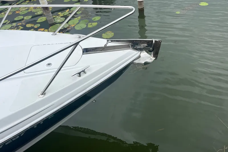 Slide: The Image of 2006 Formula 370 Super Sport boat bow with stainless steel railings on calm water. - 19