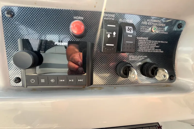Slide: The Image of Control panel of a 2006 Formula 370 Super Sport boat with various switches and keys. - 7