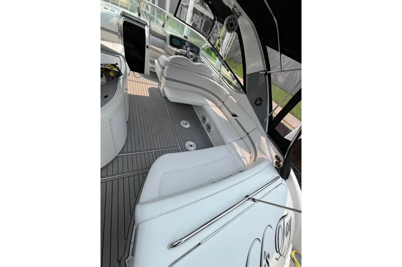Slide: The Image of Interior view of a 2006 Formula 370 Super Sport boat with white seating and sleek design. - 9