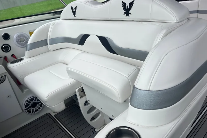 Slide: The Image of Luxurious white seating in a 2006 Formula 370 Super Sport boat interior. - 13