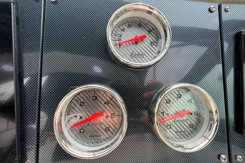 Slide: The Image of Carbon fiber dashboard with Livorsi gauges on a 2006 Formula 370 Super Sport. - 5