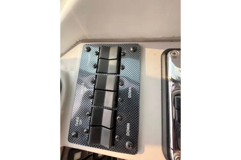 Slide: The Image of Control panel with switches on a 2006 Formula 370 Super Sport boat. - 6