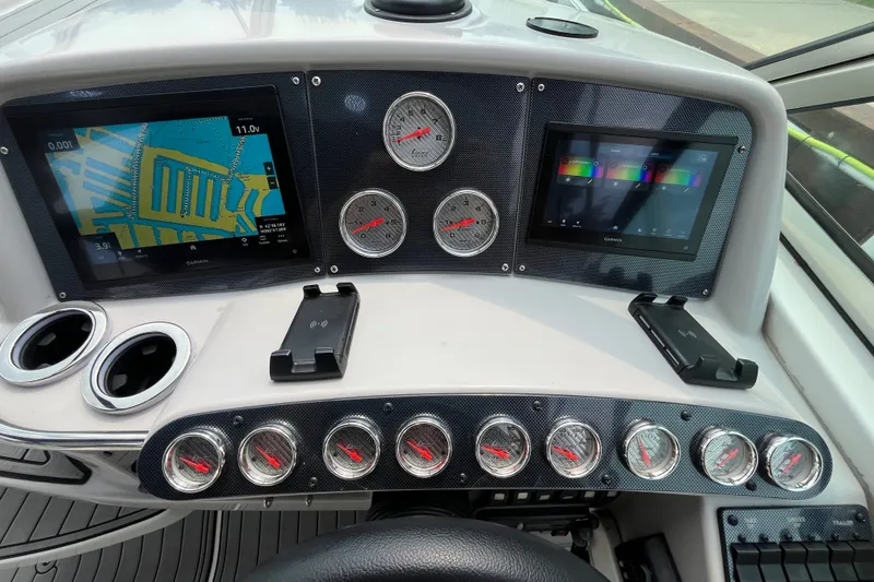 Slide: The Image of Dashboard of a 2006 Formula 370 Super Sport boat with navigation screens and gauges. - 4
