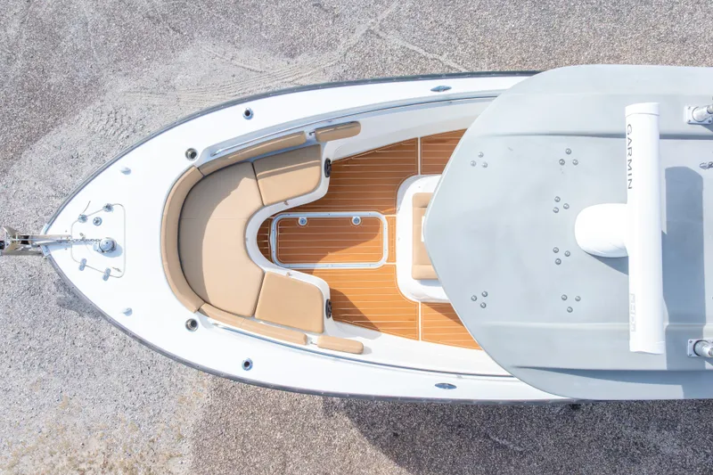 Slide: The Image of Overhead view of 2018 Cape Horn 27XS boat with tan seating and Garmin equipment. - 9
