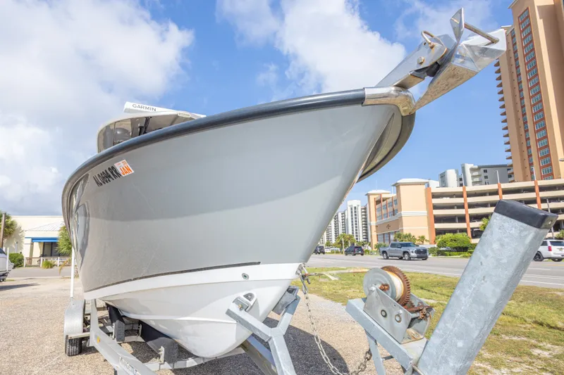 Slide: The Image of 2018 Cape Horn 27XS boat on trailer, urban background, clear sky. - 18