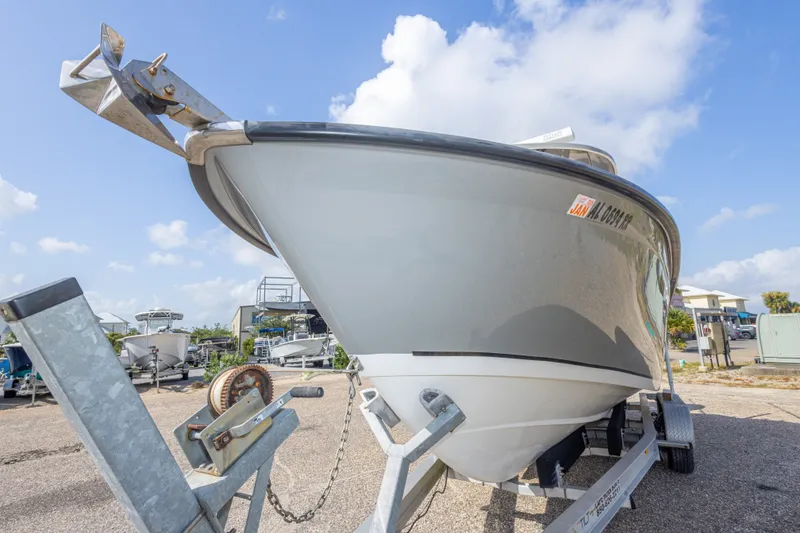 Slide: The Image of 2018 Cape Horn 27XS boat on trailer, parked outdoors under a clear sky. - 19