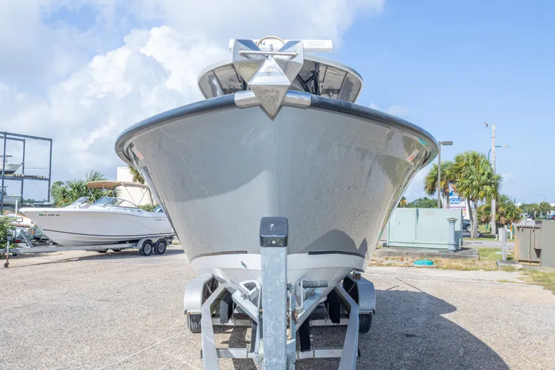 Slide: The Image of 2018 Cape Horn 27XS boat on trailer, front view, parked outdoors. - 17