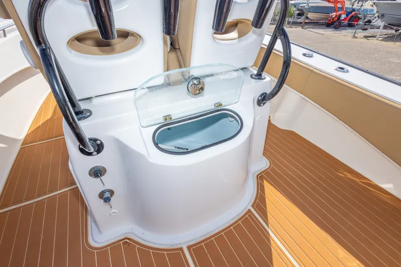 Slide: The Image of 2018 Cape Horn 27XS boat interior with livewell and teak flooring. - 43