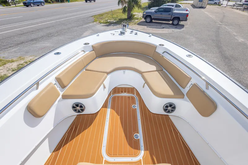 Slide: The Image of 2018 Cape Horn 27XS boat with tan seating and teak-style flooring. - 32