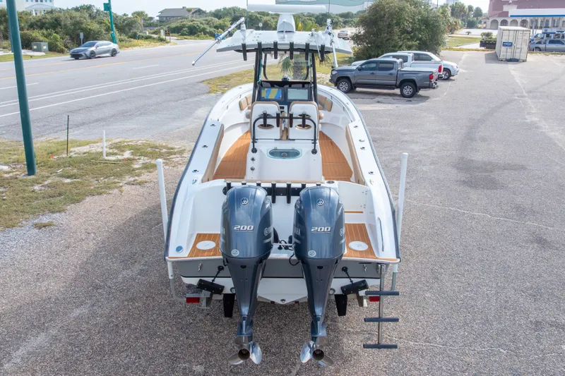 Slide: The Image of 2018 Cape Horn 27XS boat with dual Yamaha 200 engines, parked on a lot. - 48