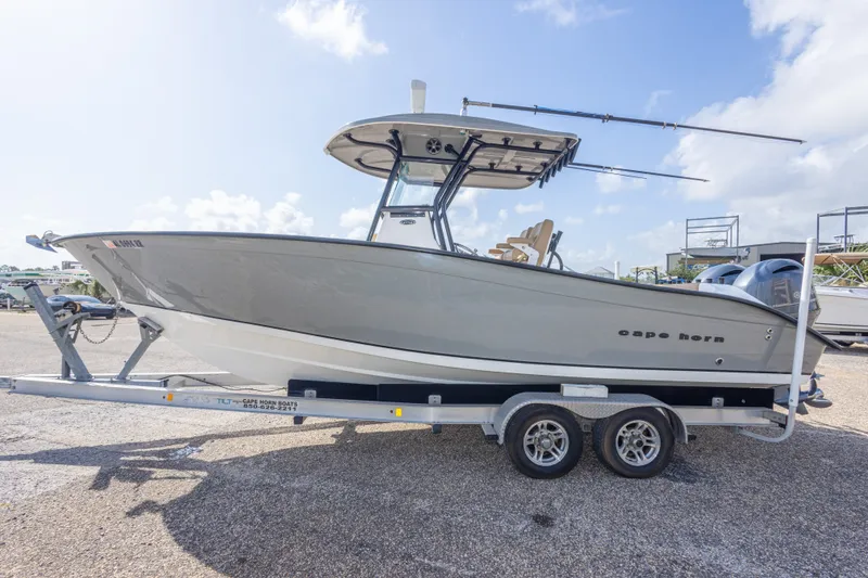 Slide: The Image of 2018 Cape Horn 27XS boat on trailer under clear sky. - 15