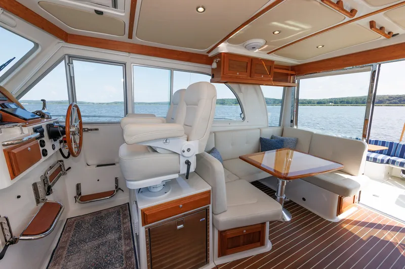 Slide: The Image of Luxurious interior of 2020 Back Cove 41 yacht with plush seating and scenic water view. - 17