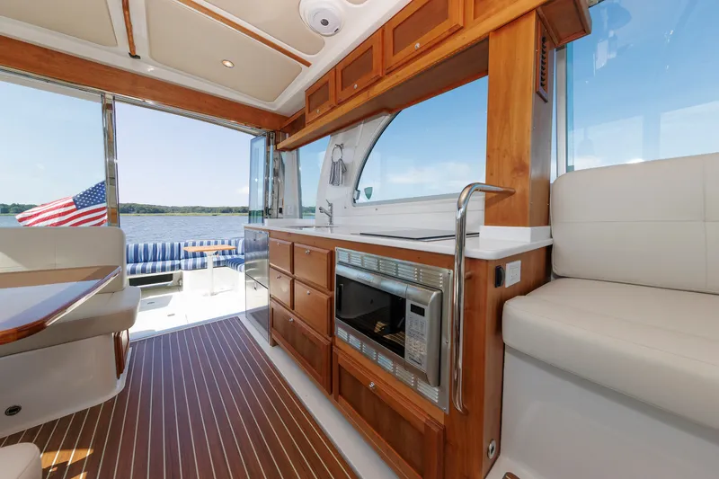 Slide: The Image of Luxurious interior of 2020 Back Cove 41 yacht with kitchenette and scenic water view. - 13