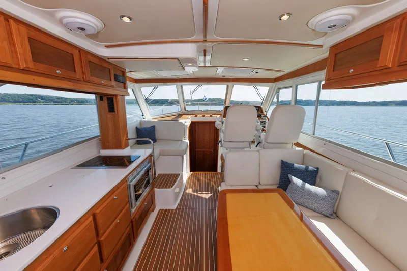 Slide: The Image of Luxurious interior of 2020 Back Cove 41 yacht with elegant wood finishes and scenic water view. - 7