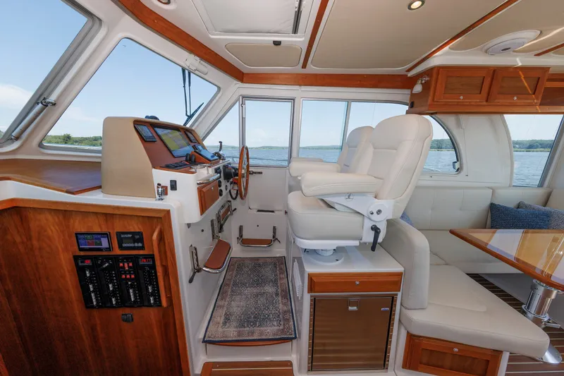 Slide: The Image of Luxurious 2020 Back Cove 41 yacht interior with plush seating and modern navigation controls. - 19
