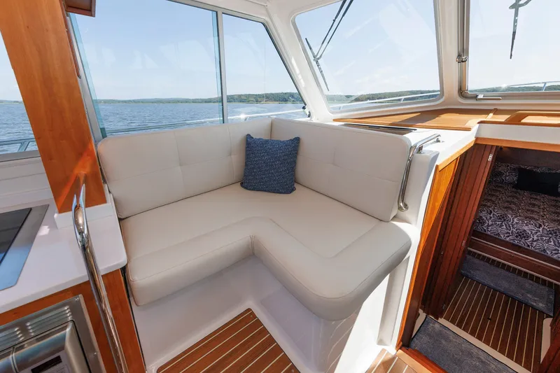 Slide: The Image of Luxurious interior of 2020 Back Cove 41 yacht with plush seating and scenic ocean view. - 16