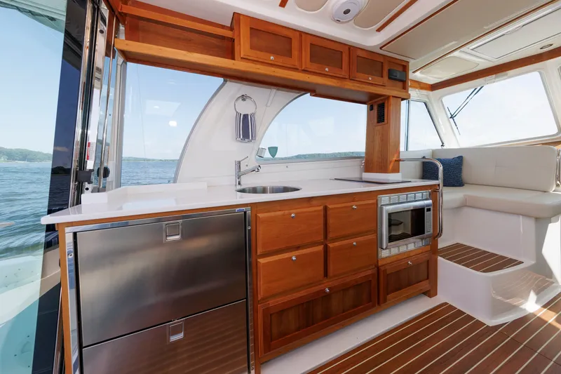 Slide: The Image of Luxurious 2020 Back Cove 41 yacht interior with modern kitchen and scenic ocean view. - 9