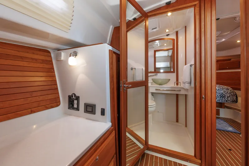 Slide: The Image of Luxurious 2020 Back Cove 41 yacht interior with elegant wood finishes and modern bathroom. - 27