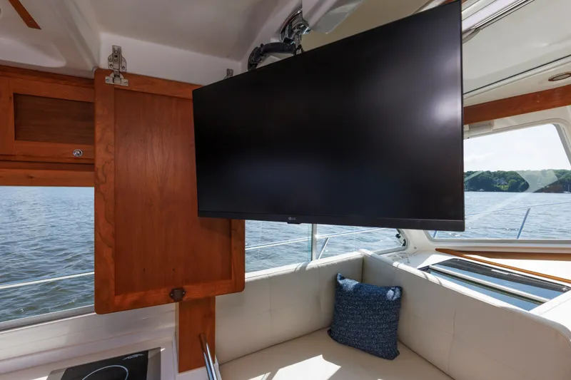 Slide: The Image of Interior of 2020 Back Cove 41 yacht with TV and scenic water view. - 11